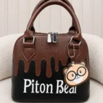 کیف دستی زنانه پیتون بیر مشکی قهوه‌ای با آویز خرسی