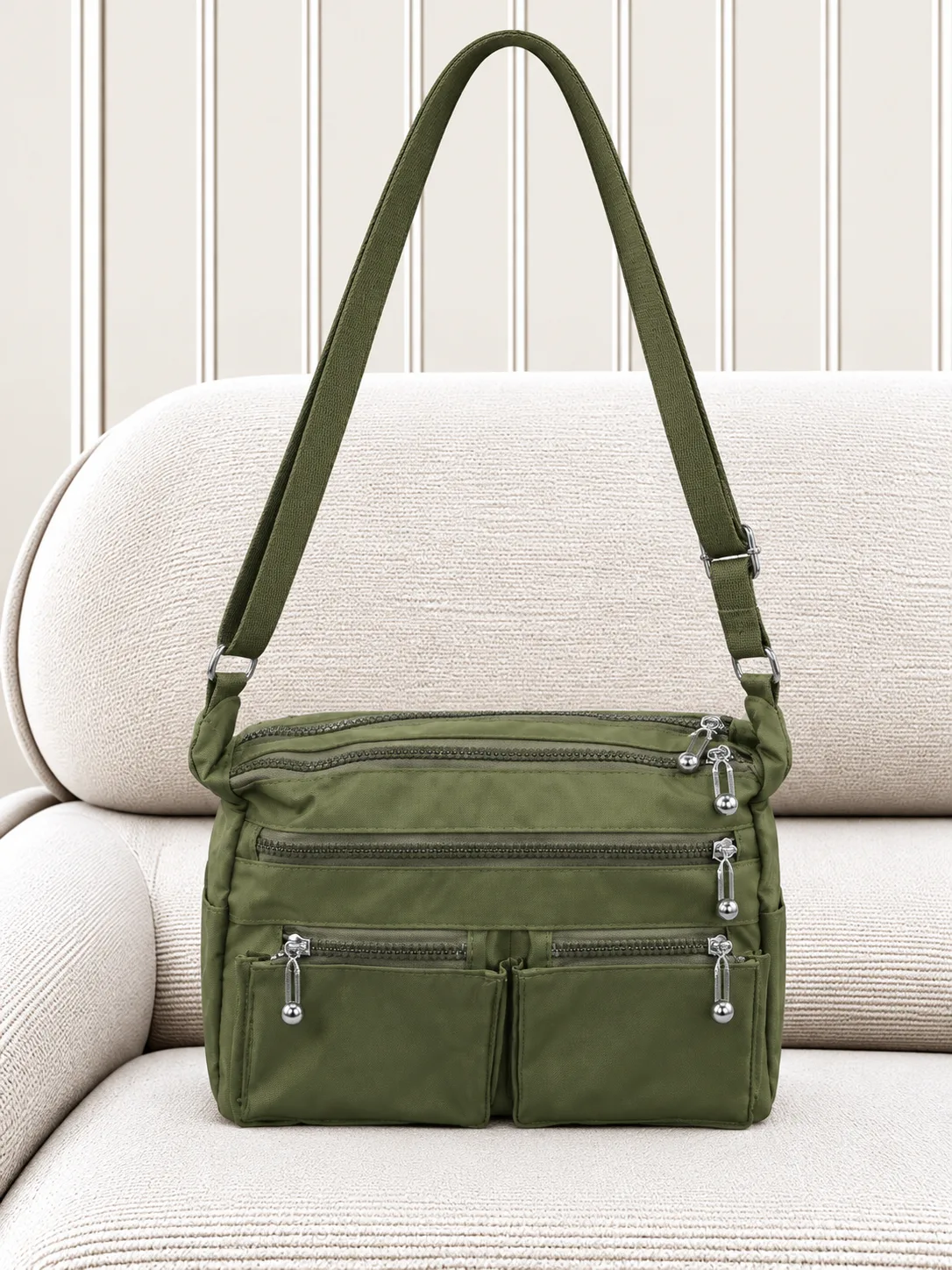 olive-green-womens-student-multi-pocket-shoulder-bag.webp کیف دوشی زنانه دانشجویی سبز زیتونی چندجیب با بند بلند قابل تنظیم