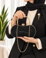 کیف مجلسی زنانه مشکی نگین‌دار طرح لوبیایی با زنجیر طلایی